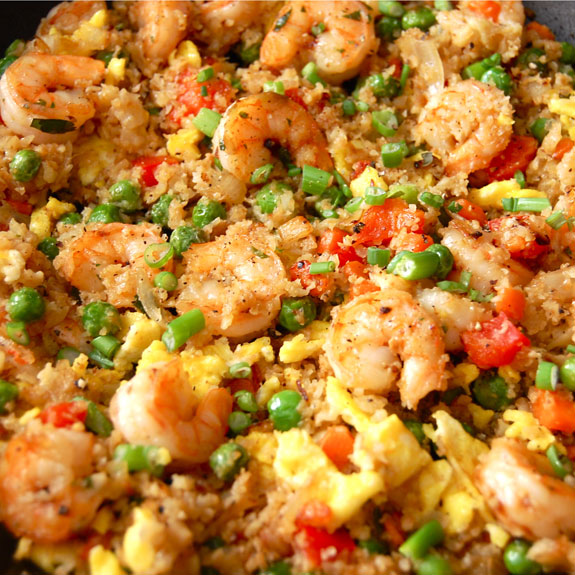 Paleo Shrimp Fried “Rice”- a healthier version of fried rice. Uses cauliflower to replace the rice. It’s low carb and tastes just as good!