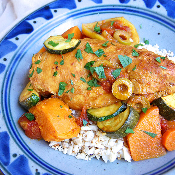 Paleo Chicken Tagine with Olives and Sweet Potatoes- I love this dish so much! Full of flavor and absolutely delectable.