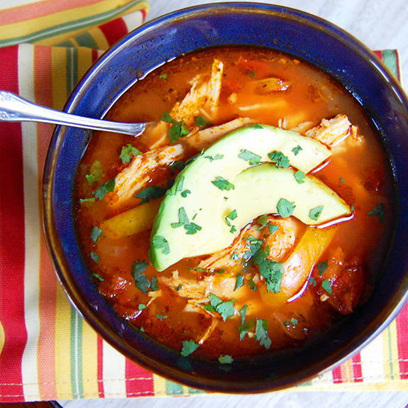 Slow Cooker Chicken Enchilada Soup- holy moly this is good! One of my favorite Paleo soups of all-time.