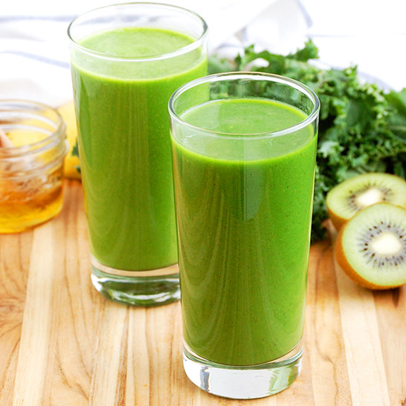 Kale and Kiwi Superpowered Green Smoothie- one of my all-time favorite Paleo smoothies! I feel like I could punch through a brick wall after drinking this, lol. Seriously though.