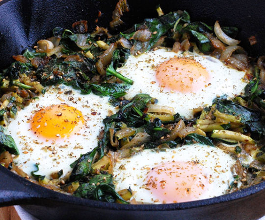 Green Paleo Shakshuka (Good for Any Meal)- This healthy and satisfying dish is a lighter, greener version of traditional shakshuka. It’s ideal for any time of the day, whether it’s brunch, lunch, or late dinner. Warm eggs are cooked over a garlicky mix of zucchini, spinach, and onions for a flavorful and delicious meal.