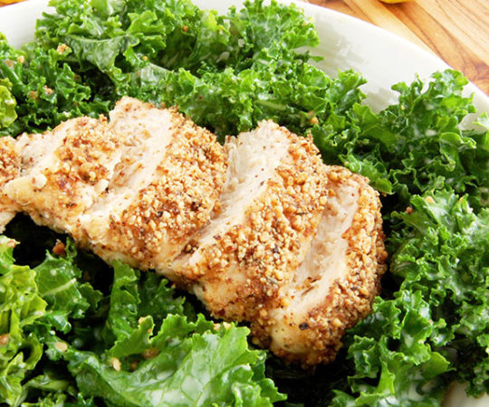 Kale Caesar Salad with Almond-Crusted Chicken- This recipe introduces an updated version of classic Caesar salad. Kale is substituted as the base of the salad instead of romaine because of its nutritional punch and heartiness. Along with creamy homemade dressing, the salad is topped with crunchy almond-crusted chicken. Only wholesome, natural ingredients are used for this filling meal.