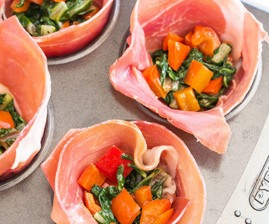 Make these salty, wholesome egg muffins in prosciutto cups for a high protein breakfast on the go!