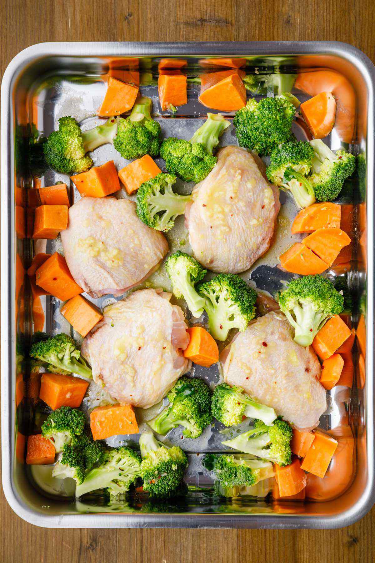 Sheet Pan Chicken Thighs With Sweet Potato And Broccoli